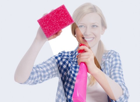 Technician performing hot water extraction on carpet fibers